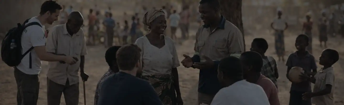 Ministry team gathered with community members in the mission field